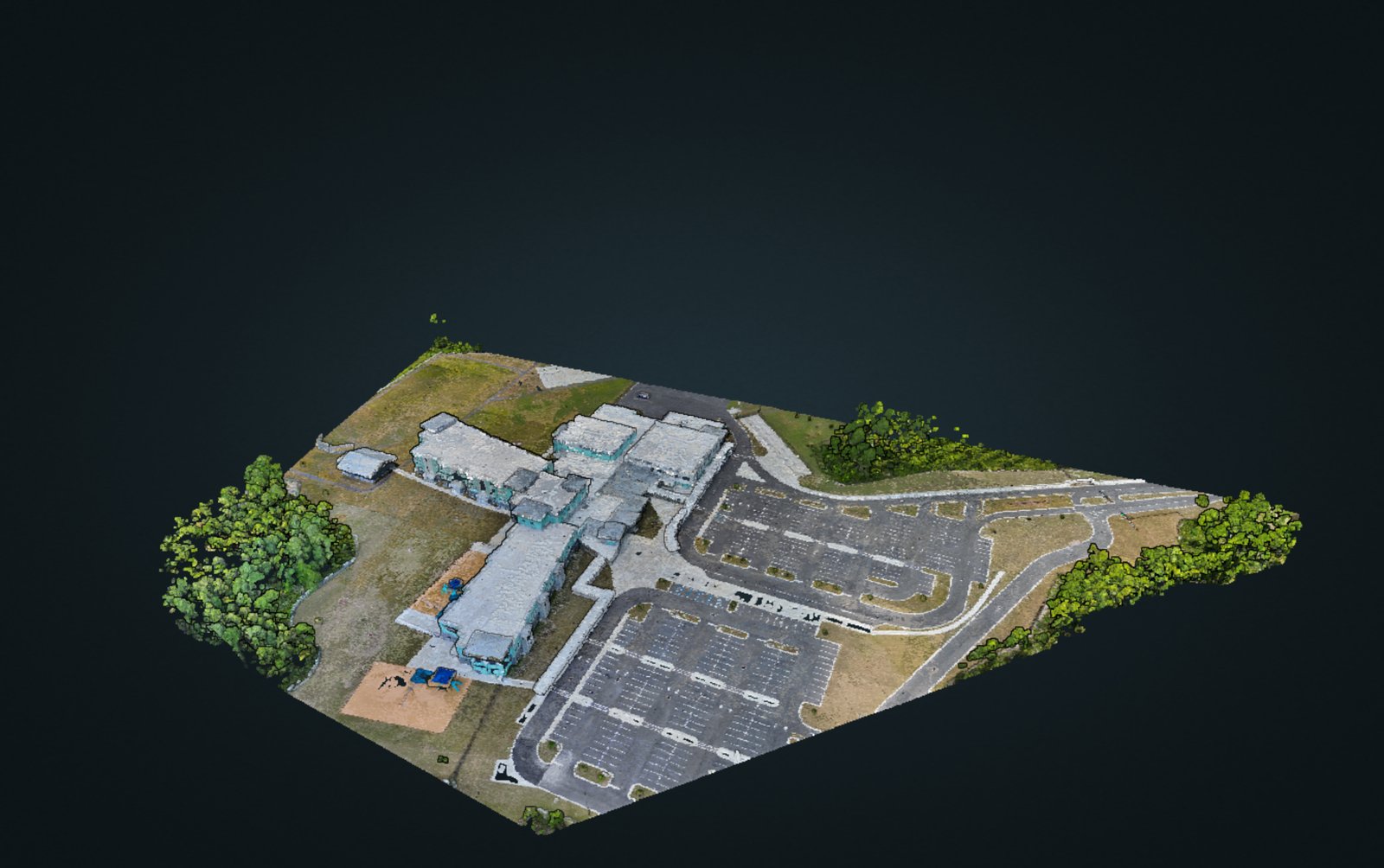 3D textured mesh reconstruction of a commercial building with parking lots, rendered from aerial photogrammetry